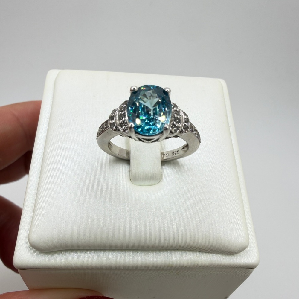 Stunning 7x9mm oval cut BLUE ZIRCON and diamond accent ring in sterling silver!